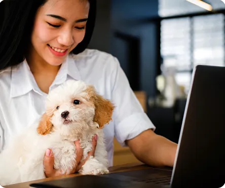 A woman holding a dog