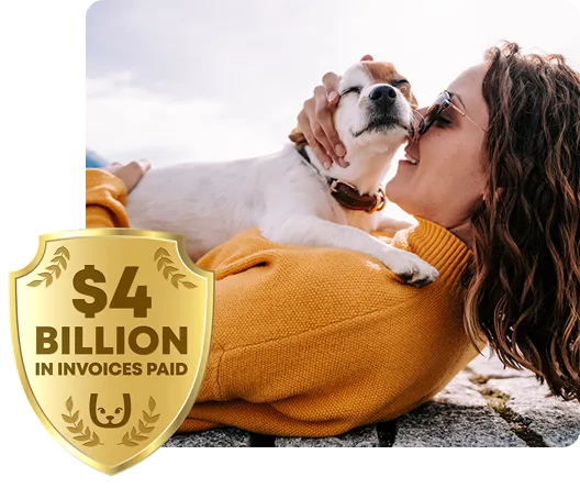 Woman laying on a seawall with her pet dog sitting on her. Trupanion $3 billion logo in the corner.