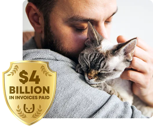 A man snuggling a cat.