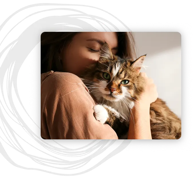 A woman hugging her cat