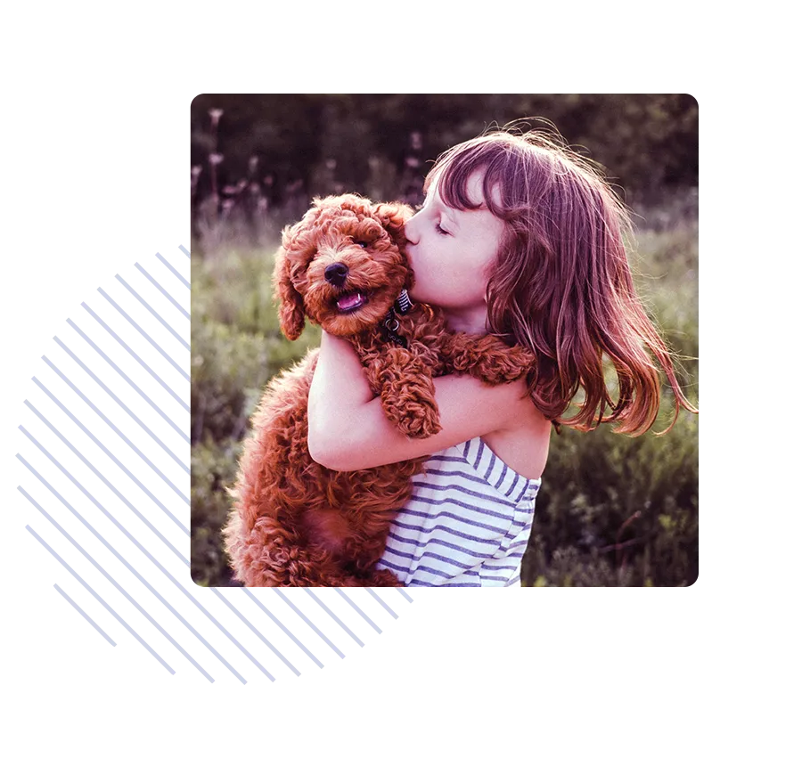 A girl kissing a dog
