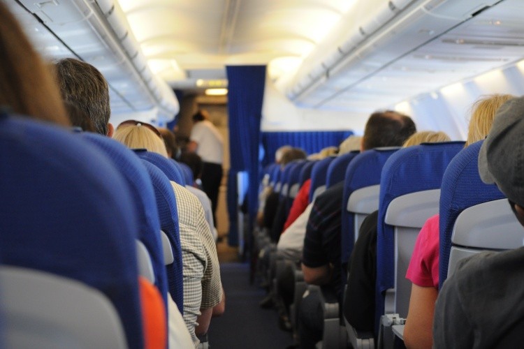 airplane cabin with passengers
